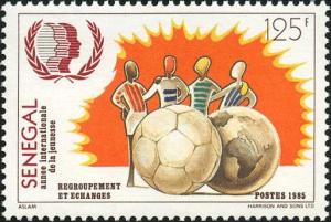 Colnect-2069-922-Sports-Exchange--ndash--Players-Surrounding-Football-and-Globe.jpg