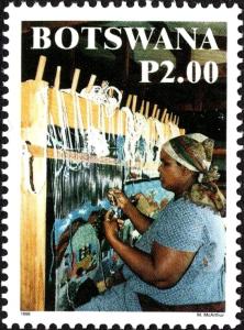 Colnect-6129-394-Woman-at-Loom.jpg