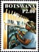 Colnect-6129-394-Woman-at-Loom.jpg